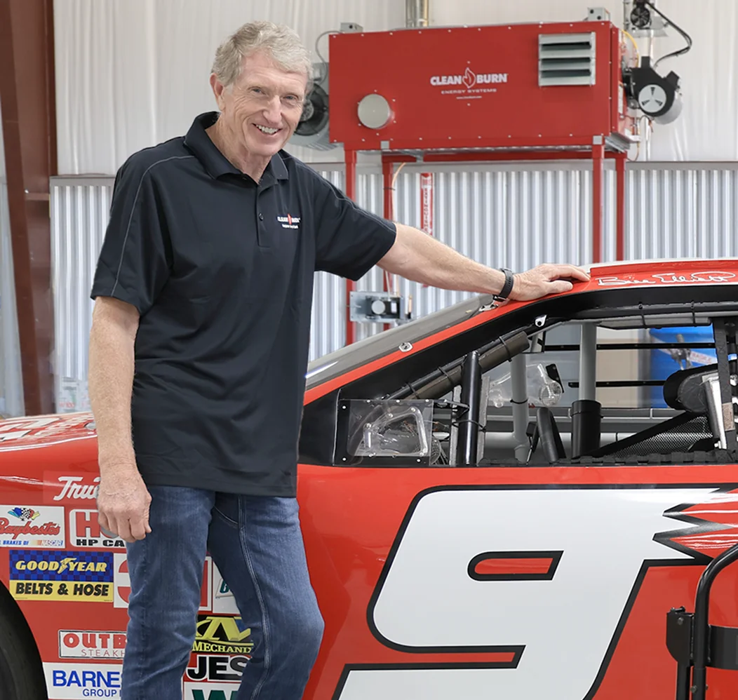 BillElliott_CleanBurn Bill Elliott standing with race car in front of Clean Burn heater